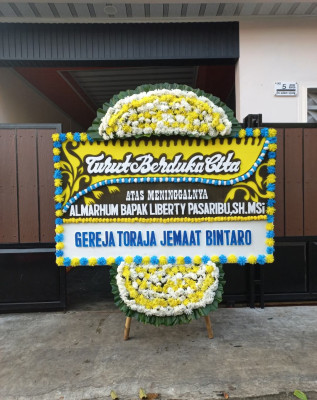 Papan Bunga Duka di Pantan Cuaca